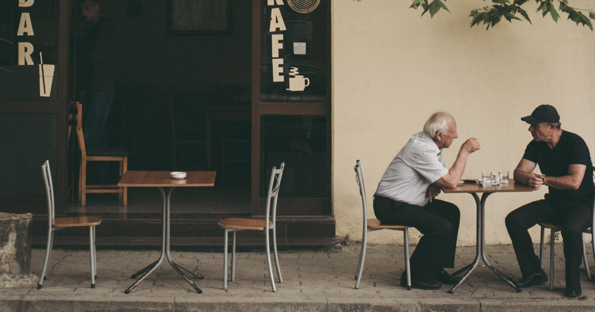 Two men in conversation
